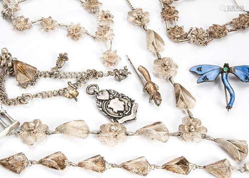 A collection of silver jewels, including a George V silver and enamel dragonfly brooch, a