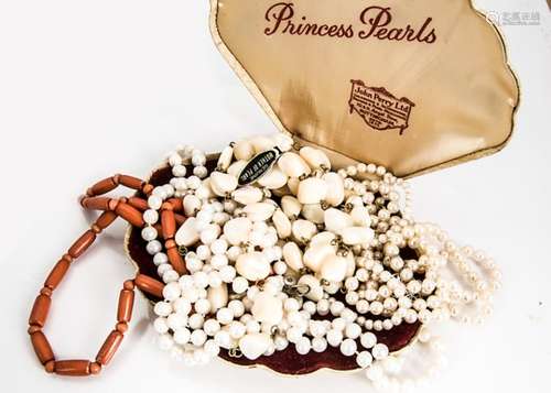 A collection of freshwater and simulated pearls, including a mother of pearl necklace and a coral