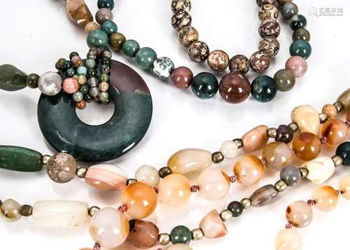 A collection of hardstone beads, including rock crystal, agate, garnet and other items