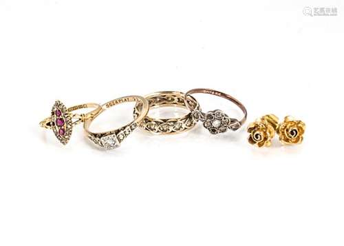 Four gem set gold rings, including a navette shaped ruby and diamond 18ct gold example, a diamond