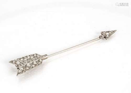 A platinum and diamond gold mounted jabot pin, in the form of an arrow, the encrusted arrow head and