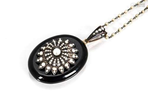 A 19th Century gold, onyx and silver seed pearl set mourning pendant, the central flower head