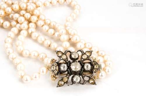 A three string cultured pearl necklace, the uniform knotted strung pearls united by a 19th Century