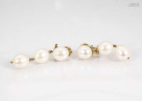 A pair of 18ct gold and oval drop earrings, the three oval pearls with gold links on an 18ct gold