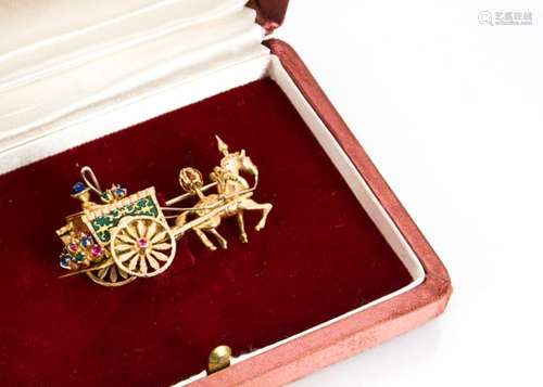 A continental gold, enamel and gem set brooch, modelled as a horse and carriage, the decorated horse