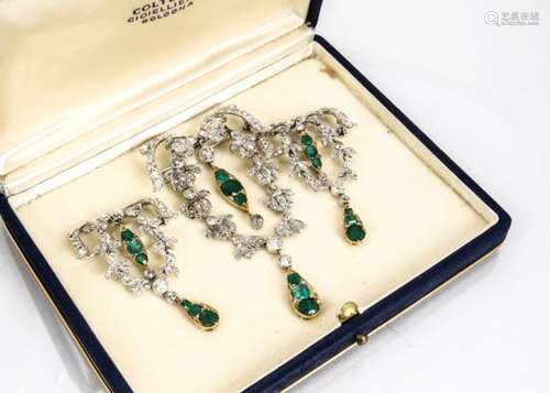 A set of three diamond and emerald drop evening brooches, the diamond set festoons and floral