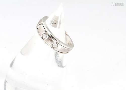 A continental three stone diamond white metal dress ring, ring size H, 6.4g