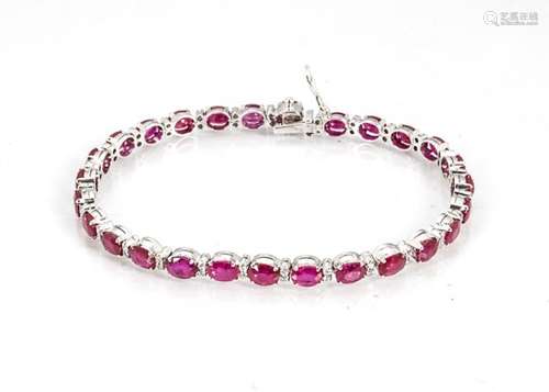 A ruby and diamond line bracelet, the oval mixed cut rubies alternately set with pairs of