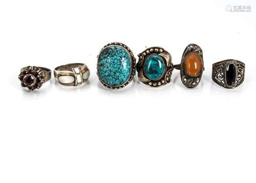 A collection of white metal gem set and plain Middle Eastern and contemporary silver dress rings