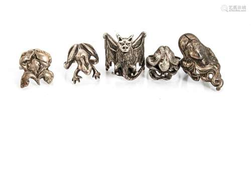 Five animal and figural silver rings, including three Art Nouveau maidens, a bat, and frog