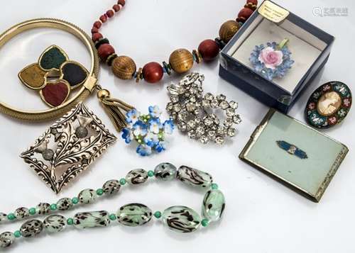 A quantity of costume jewellery, including rolled gold child's bangle, 1960s oval brooch with red