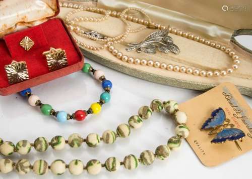 A group of early 20th Century and later costume jewellery, including a Mizpah double heart brooch,