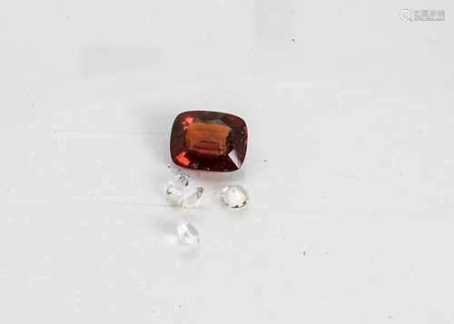 A large almandine garnet, step cut, loose stone, 13.8mm x 11mm x 6.2mm together with four circular