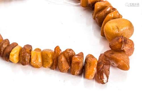 An amber graduated rough bead necklace, with screw clasp, 53cm long, 56g