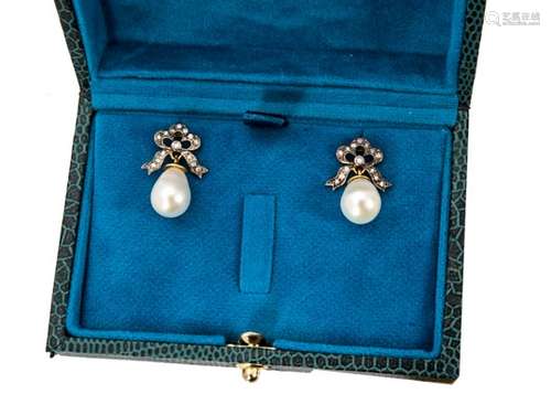 A pair of cultured pearl and diamond earring studs, in the antique style, the diamond set bows