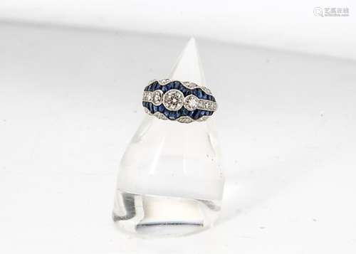 A sapphire and diamond bombe half hoop dress ring, the central three diamonds flanked by pave set