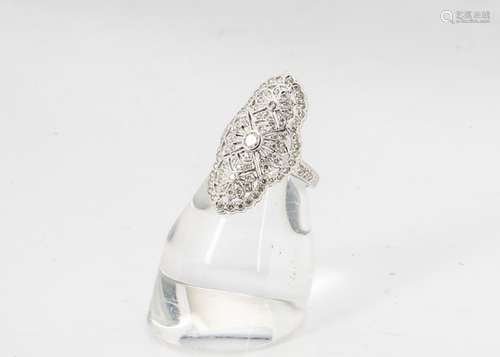 An 18ct white gold Art Deco style diamond encrusted dress ring, of oval design with pierced fans and