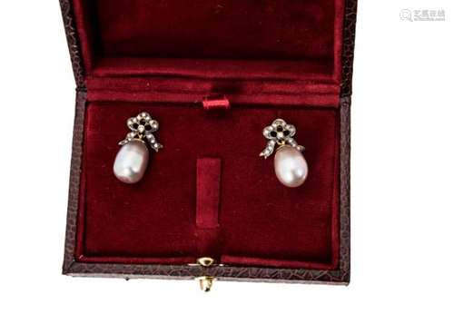 A pair of diamond and cultured pearl ear studs, the diamond set bows supporting grey oval pearls,