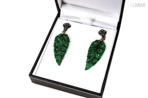 A pair of jade, diamond and emerald earrings, the leaf carved jade drops supported on fleur de lys