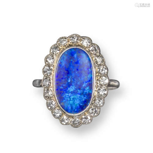 A black opal and diamond ring