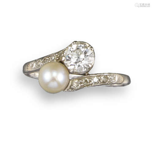 An Edwardian untested pearl and diamond crossover ring