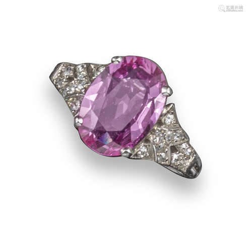 A pink sapphire and diamond ring