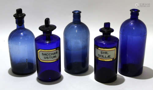 Group of blue coloured apothecary bottles with stoppers