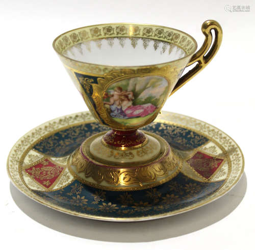 Vienna style cup and saucer decorated in gilt with a panel depicting a classical scene