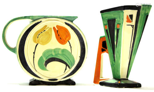 Two Art Deco Myott jugs with typical geometric designs in green, red and black, the jugs with gold