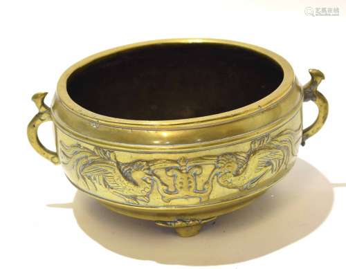 19th century Chinese circular brass bowl with raised decoration of birds holding a scroll, two