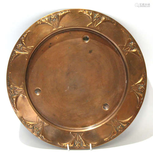 Copper Art Nouveau style tray, the border with a floral motif, 32cm diam