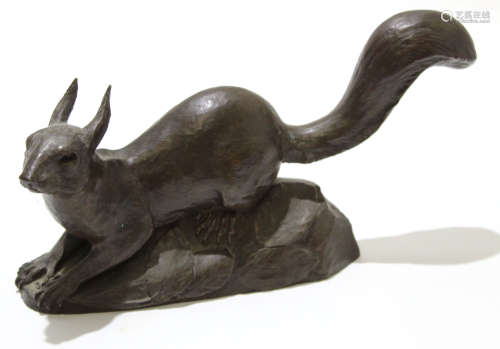 Spelter model of a squirrel on leafy base, 27cm long