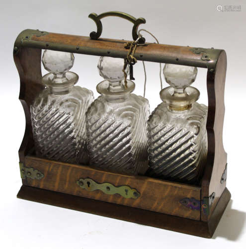 Late 19th/early 20th century oak tantalus complete with original key and three glass decanters