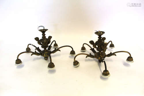Pair of small reproduction brass five-sconce electroliers, central shafts with figure decoration,