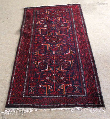Modern Caucasian style runner, central panel of geometric designs, mainly red field, 185 x 93cm