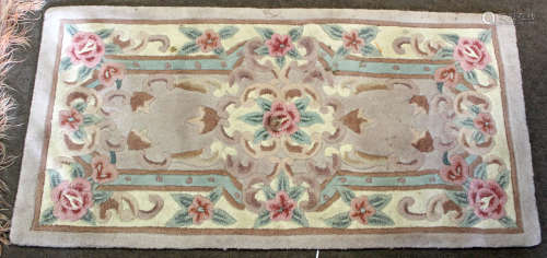 Small Chinese or Indian rug with typical floral decoration, 62 x 122cm