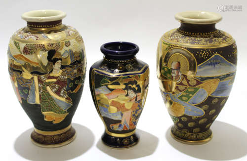 Pair of Japanese Satsuma earthenware vases heavily decorated with warriors in relief and a