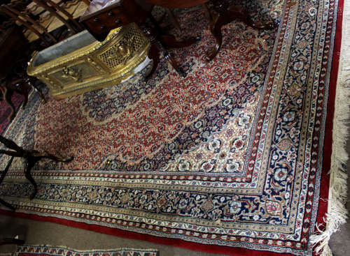 Large modern Caucasian type carpet with central lozenge, predominantly blues and red field with