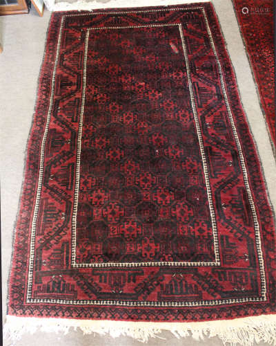 Caucasian carpet, central panel of interlinked geometric lozenges within double gull border, 106 x