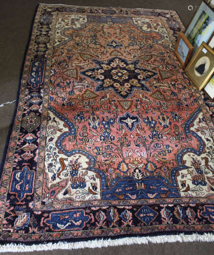 Modern Caucasian wool carpet, central floral rosette and triple gull border mainly shaded blue and