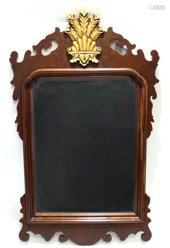 Set of four mahogany reproduction Chippendale style wall mirrors, each crested with gilded panels of