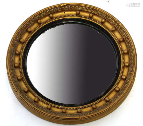 Regency style gilt circular wall mirror with ball moulded surround and convex centre, 49cm diam