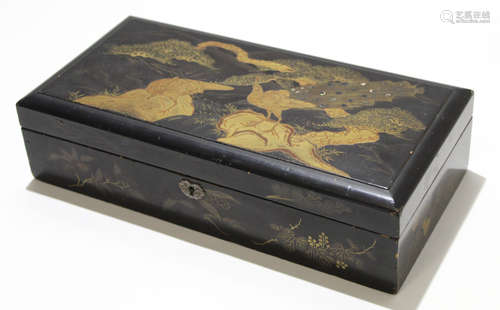 Oriental lacquer box with fitted interior, the cover decorated with peacocks, 35cm long