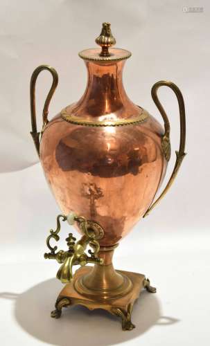 Neo-classical designed copper and brass tea urn with beaded swept handles, brass tap, four footed