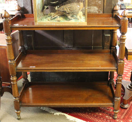 Late 19th/early 20th century mahogany three tier buffet, the four columns crested with corners