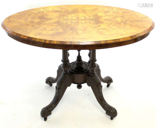 Victorian oval loo table, the top inlaid with satinwood stringing and foliage, raised on a four