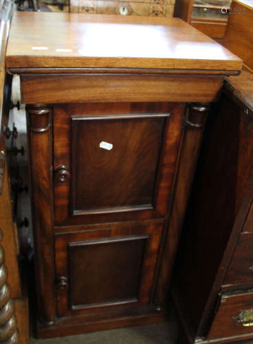 19th century mahogany pot cupboard of square form, trunk fitted with two panelled doors enclosing