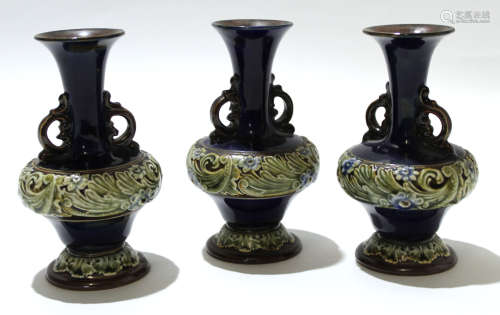 Group of three mid-20th century Royal Doulton vases with a tube lined floral design to base and