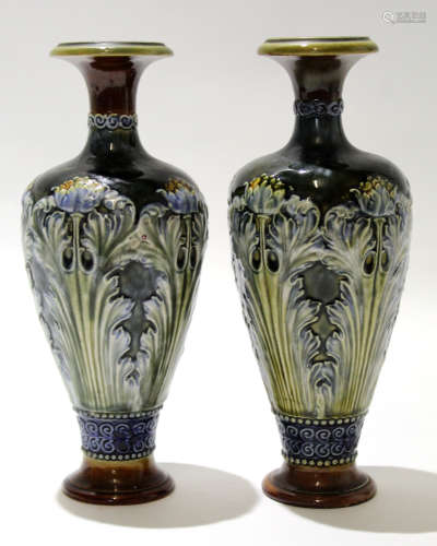 Pair of early 20th century Royal Doulton vases, the green ground decorated in Art Nouveau style with