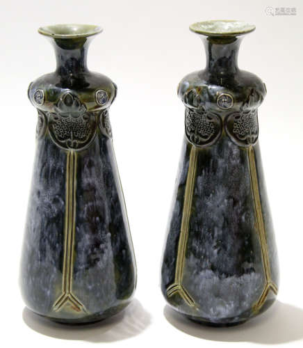 Pair of early 20th century Royal Doulton vases with tube lined Art Nouveau floral design on a